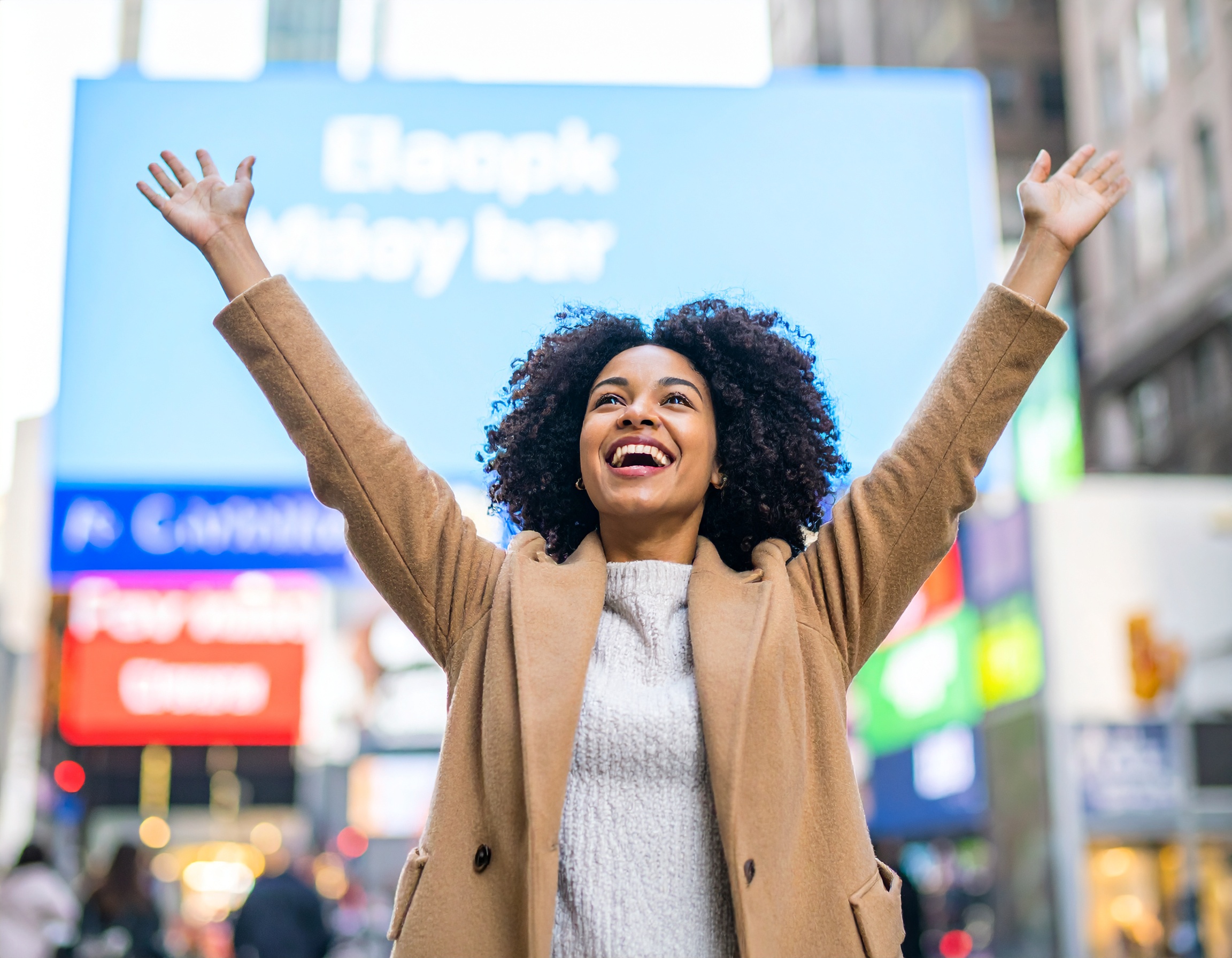 Advertiser celebrating her ad going live on city digital screens